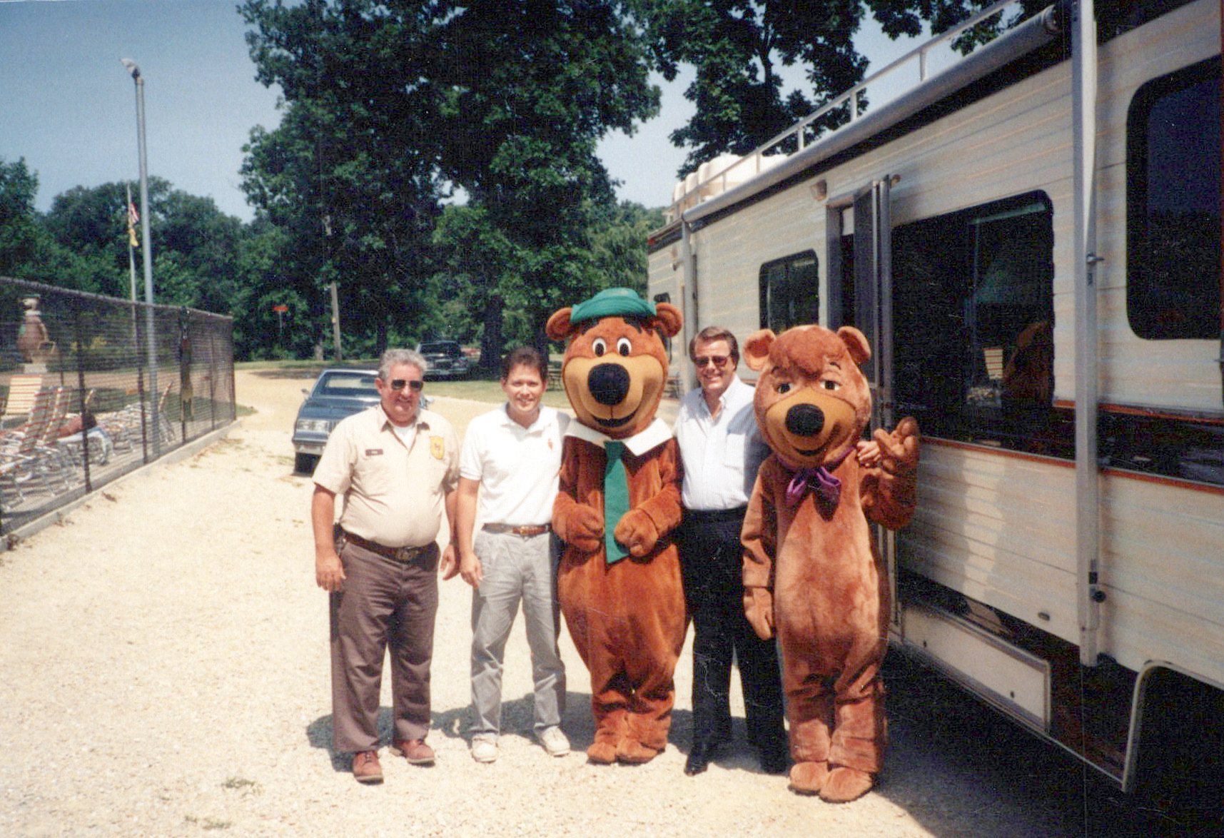 Dan O’Connell (far left), Rob Schutter, and Jim Ashworth visit with Yogi Bear and Boo Boo